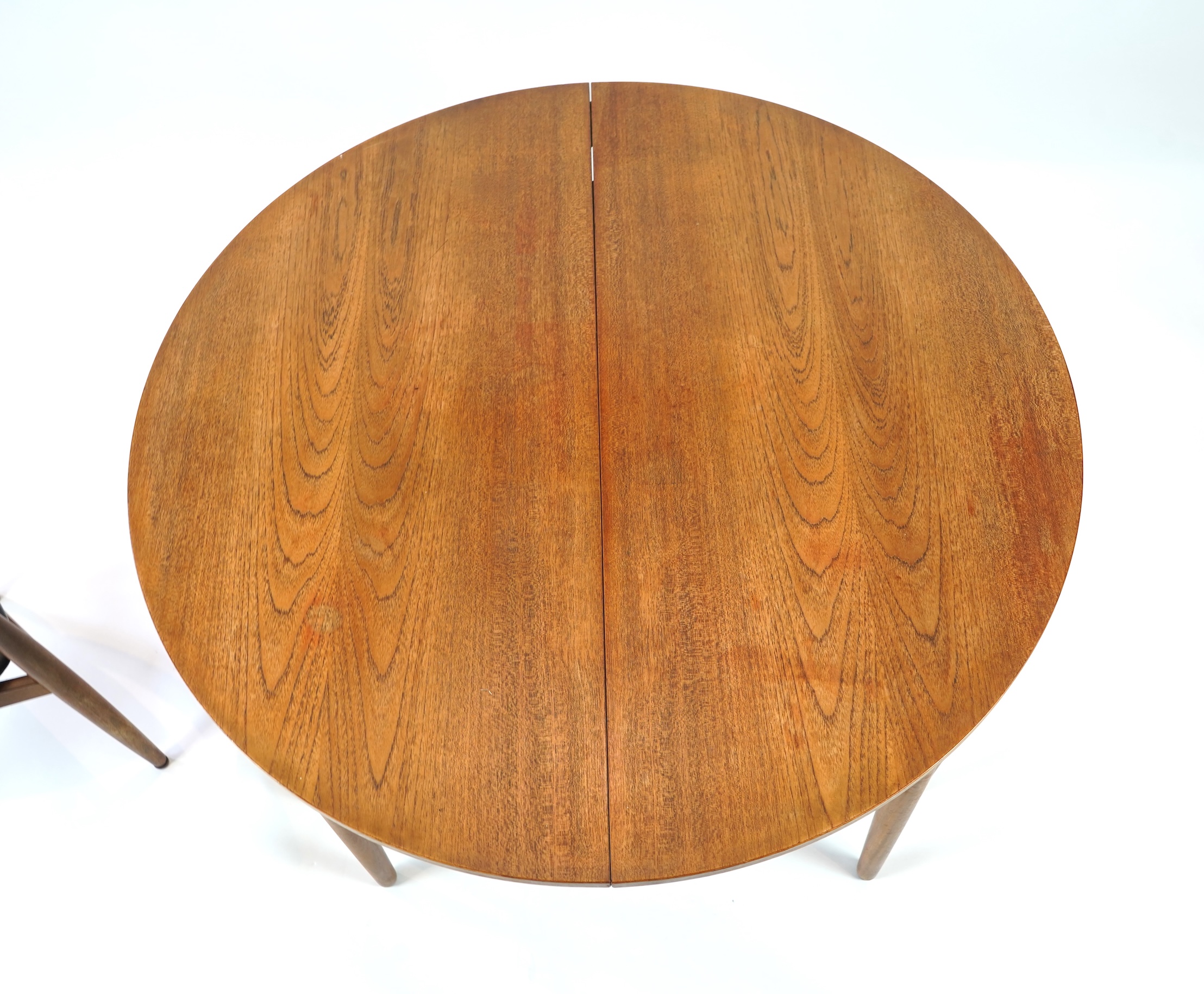 Hans Olsen (Danish, 1919–1992) for Frem Røjle: A Danish teak 'Roundette' extending dining table and four chairs